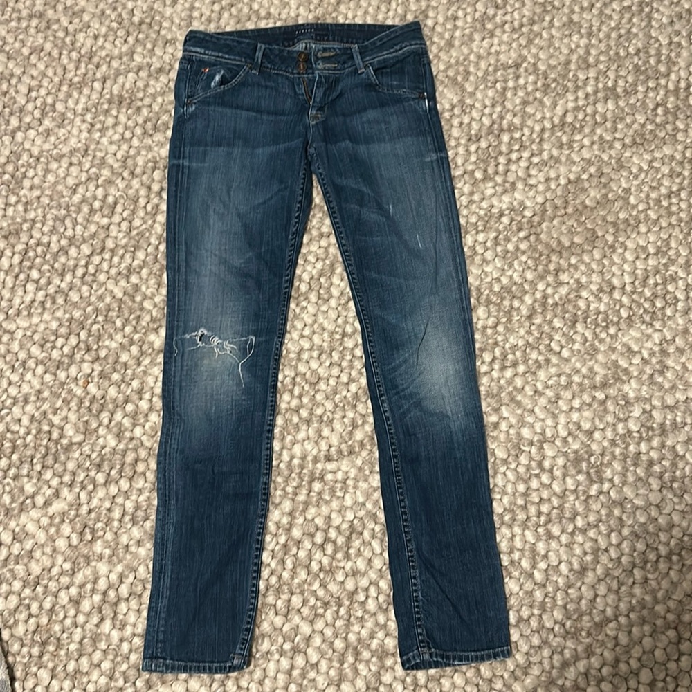 Hudson Jeans. Decorative hole in right leg.
